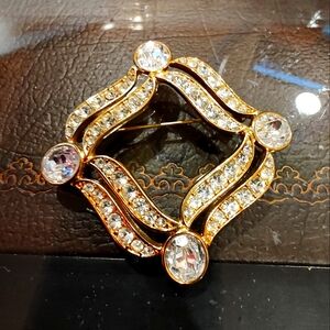 Vintage Gold Tone And Rhinestone brooch.